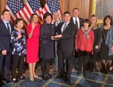 U.S. Representative TJ Cox is sworn in Thursday, Jan. 3, by House Speaker Nancy Pelosi as friends and family members join him in the Capitol.